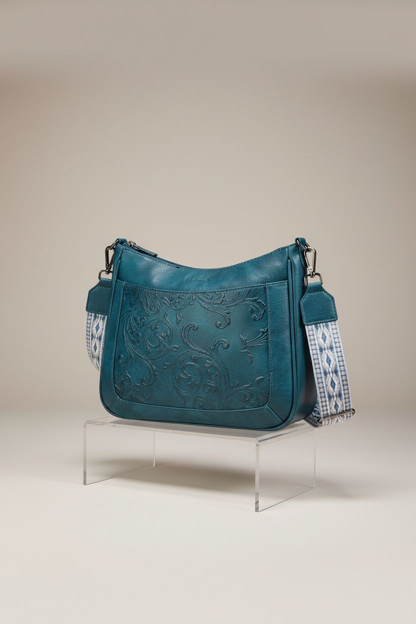 VIMUTI teal vegan leather purse on display, highlighting embossed floral pattern and premium design.