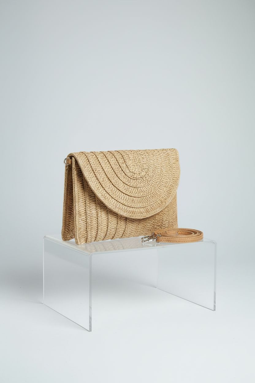 COOKOOKY light brown woven purse on a minimal backdrop, highlighting its stylish design