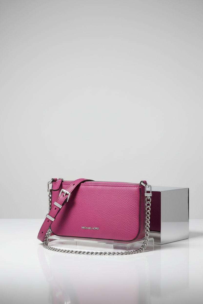 Michael Kors Wild Berry crossbody bag displayed on light dove-gray backdrop