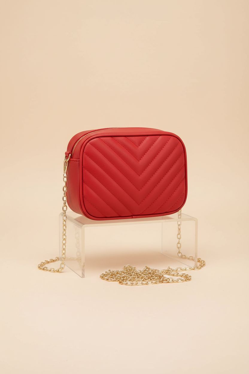 Product shot of a red crossbody purse by Generic on a light background, showcasing its details.
