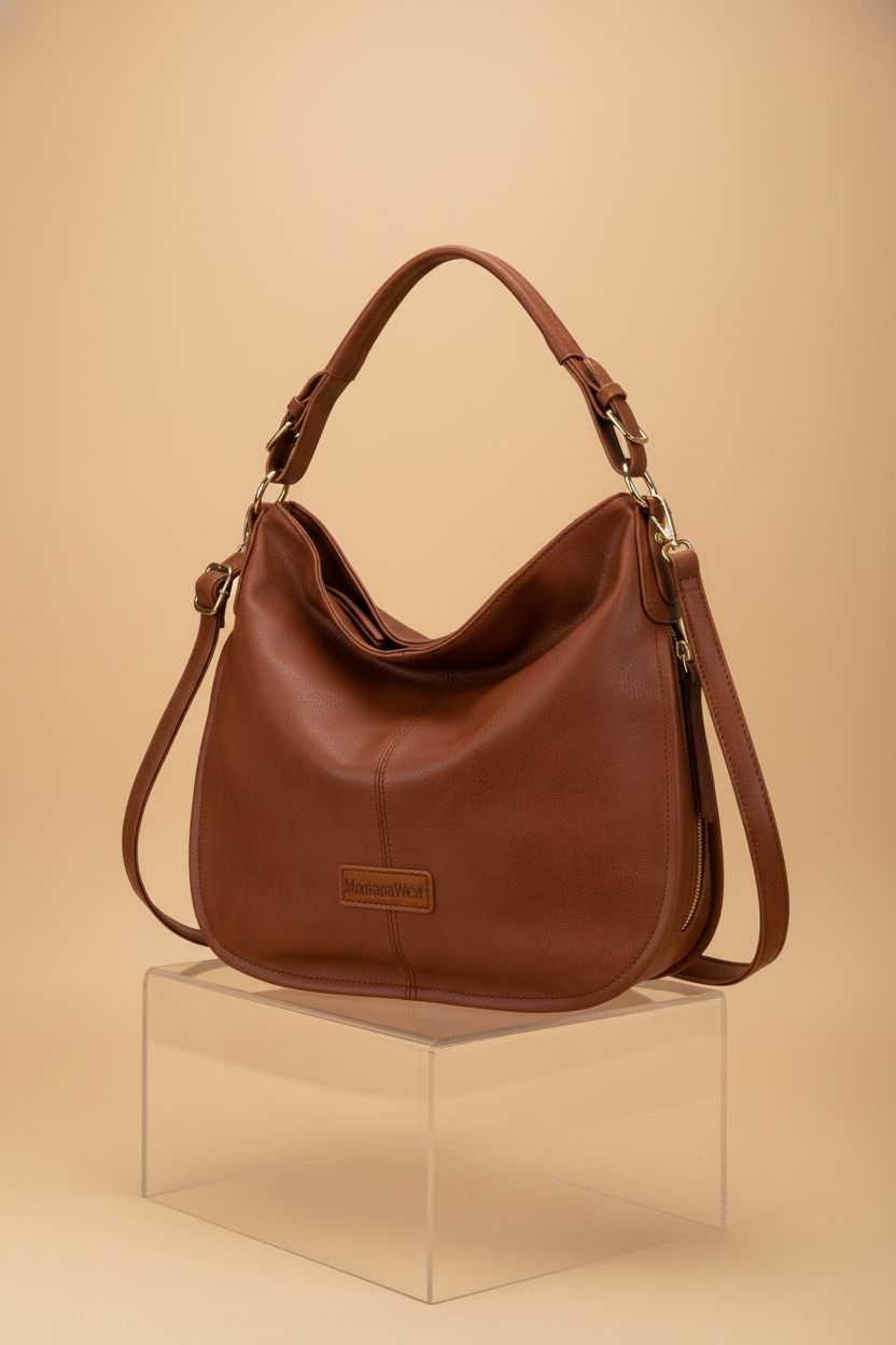 Montana West adjustable shoulder bag displayed on an acrylic cube for clarity.